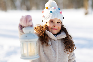 Image showing happy little girl with christmas lantern in winter