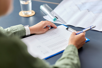 Image showing architect with clipboard working at office