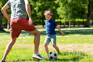 Image showing father with little son playing soccer at park