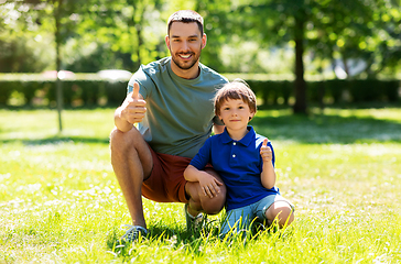 Image showing happy smiling father and little son at summer park