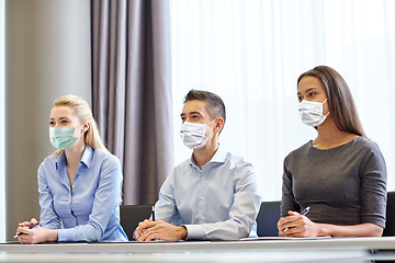 Image showing group of business people in masks at office
