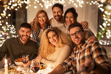 Image showing friends taking selfie at christmas dinner party