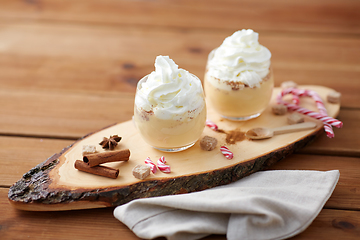 Image showing glasses of eggnog with whipped cream and anise