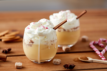 Image showing glasses of eggnog with whipped cream and cinnamon