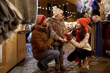 Image showing happy family at christmas market in city