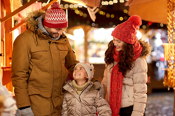 Image showing happy family at christmas market in city