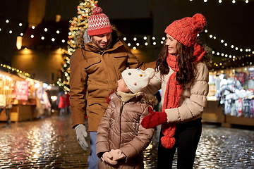 Image showing happy family at christmas market in city