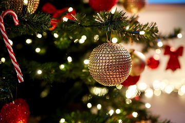 Image showing golden christmas ball decoration on fir tree