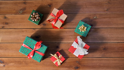 Image showing christmas gifts on wooden boards