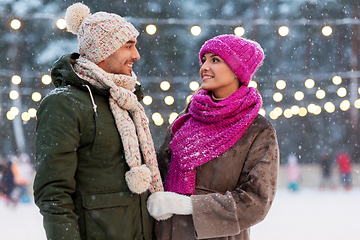 Image showing happy couple at outdoor skating rink in winter