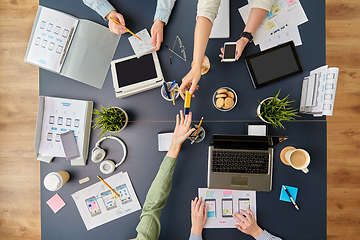 Image showing business team with gadgets working at office table