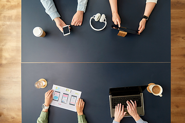 Image showing business team with gadgets working at office table