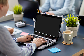 Image showing businesswoman with laptop working at office