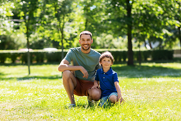 Image showing happy smiling father and little son at summer park