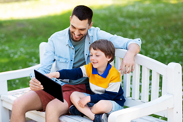 Image showing father and son with tablet pc computer at park