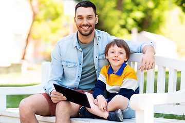 Image showing father and son with tablet pc computer at park