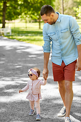 Image showing happy father with baby daughter at summer park