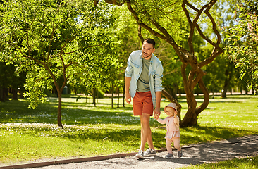 Image showing happy father with baby daughter at summer park