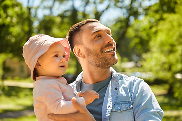 Image showing happy father with baby daughter at summer park