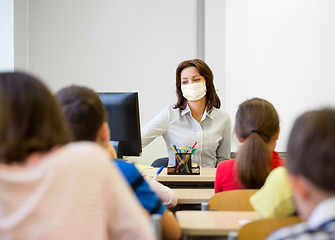 Image showing teacher wearing face protective mask at school