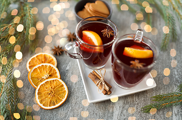 Image showing mulled wine, orange slices, gingerbread and spices