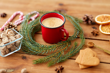 Image showing cup of eggnog, fir branches, gingerbread and sugar