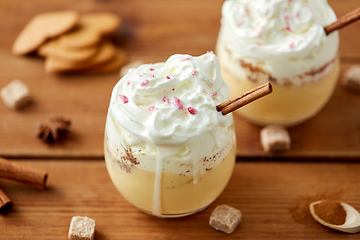 Image showing glasses of eggnog with whipped cream and cinnamon