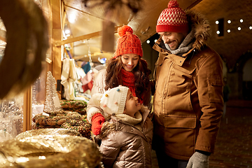 Image showing happy family at christmas market in city