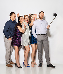 Image showing happy friends taking selfie by smartphone at party