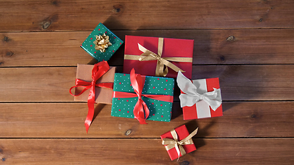Image showing christmas gifts on wooden boards