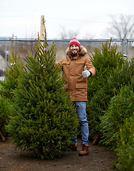 Image showing happy man buying christmas tree at market