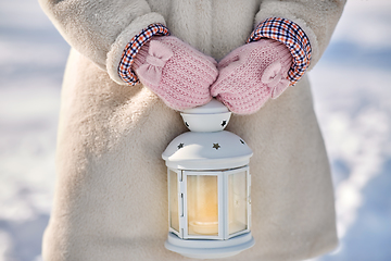 Image showing close up of girl with christmas lantern in winter