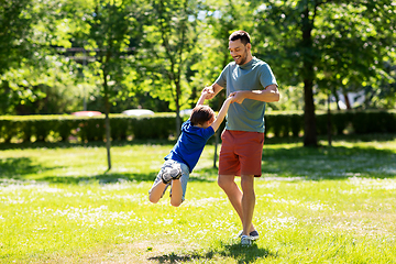 Image showing happy father with son playing in summer park