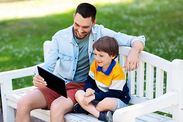 Image showing father and son with tablet pc computer at park