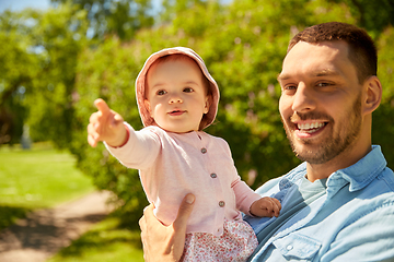 Image showing happy father with baby daughter at summer park