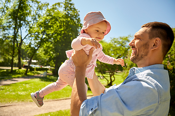 Image showing happy father with baby daughter at summer park