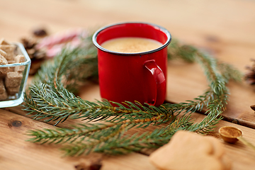 Image showing cup of eggnog, fir branches, gingerbread and sugar