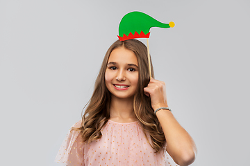 Image showing happy teenage girl with santa helper hat accessory