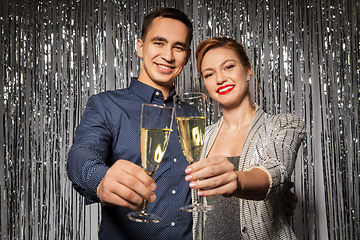 Image showing happy couple toasting champagne glasses at party