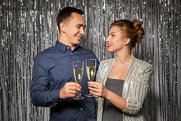 Image showing happy couple toasting champagne glasses at party