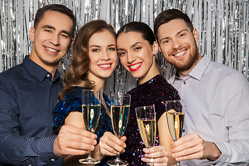 Image showing happy friends toasting champagne glasses at party