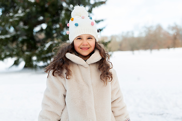 Image showing happy little girl in winter clothes outdoors