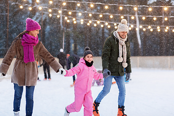 Image showing happy family at outdoor skating rink in winter