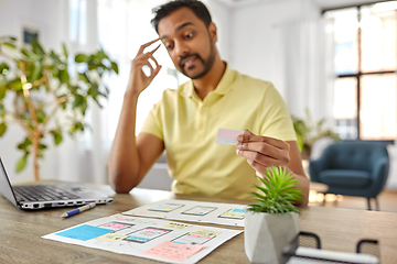 Image showing ui designer working on user interface at home