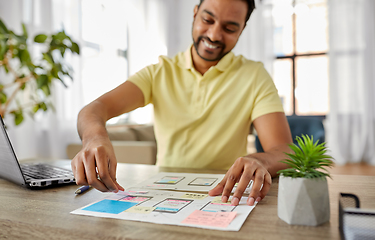 Image showing ui designer working on user interface at home