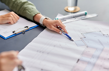 Image showing architect with blueprint working at office