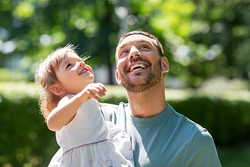 Image showing happy father with baby daughter at summer park