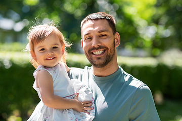 Image showing happy father with baby daughter at summer park