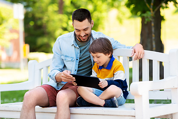 Image showing father and son with tablet pc computer at park