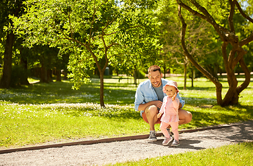 Image showing happy father with baby daughter at summer park